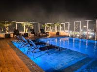 Piscina aquecida e ar condicionado no centro - Chambres d'hôtes Bertioga