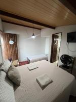 Suíte, situada na Casa Pé na Areia 027 - B&B Guarapari