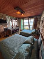 Deluxe tweepersoonskamer met balkon en uitzicht op zee