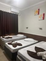 Pousada Quarto Familiar com ar,frigobar,wi fi, garagem - Chambres d'hôtes Aparecida