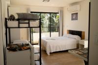 Suíte Premium com Mini Copa, Sacada e Garagem - Chambres d'hôtes Joinville