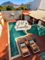 Casa com piscina em frente à Praia do Santinho - Chambres d'hôtes Florianópolis