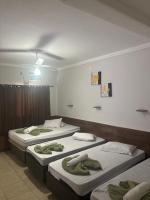Pousada Quarto Suíte Famíliar com ar,frigobar, wi fi e garagem - Chambres d'hôtes Aparecida