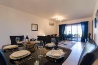 Two-Bedroom Apartment with private Garden and Pool