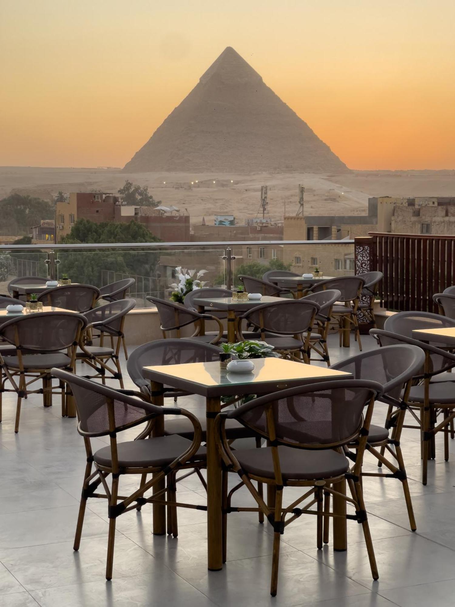 AKHNATON Pyramids View Hotel With Rooftop Access & airport pickup