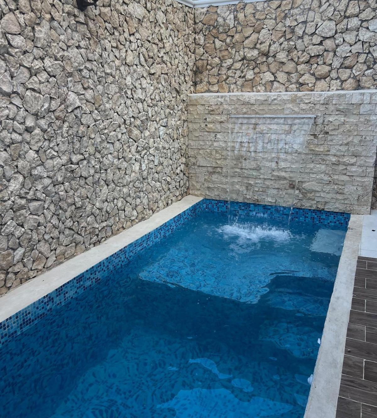 3 bedrooms home one block from the beach with pool, very central location