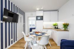 noclegi Poddąbie Apartament 1B Niebieskie Apartamenty Poddąbie z basenem krytym, odkrytym, salą zabaw, animacjami