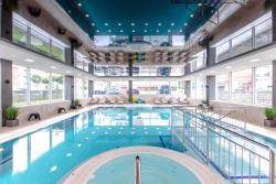 noclegi Rewal Apartament Olive Rewal z dostępem do basenu