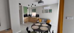 noclegi Rewal Apartament Olive Rewal z dostępem do basenu