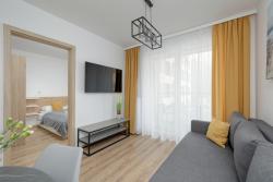 noclegi Kołobrzeg Exclusive and Modern Grey Apartment with Furnished Balcony in Kołobrzeg by Renters