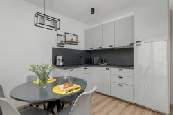 noclegi Kołobrzeg Exclusive and Modern Grey Apartment with Furnished Balcony in Kołobrzeg by Renters