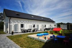 noclegi Grzybowo Gemütliches Ferienhaus in Grzybowo mit Garten, Terrasse und Grill - b53705