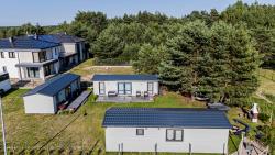 noclegi Ostrowo "AGUŚ" Komfortowe i nowczesne domki w cichej okolicy niedaleko plaży