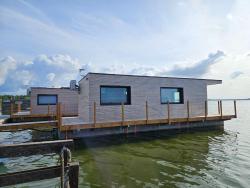noclegi Dąbki Domki na wodzie, Apartamenty, Houseboat, Jezioro Bukowo, Mierzeja "Natura Dąbkowice 5G"
