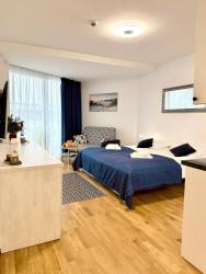 noclegi Kołobrzeg AL-DOM Apartament De Luxe z bocznym widokiem na morze i miejscem w hali garażowej