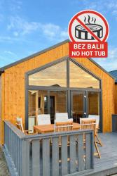 noclegi Gąski Nadmorskie Chatki - SAUNA - OPCJA Z PRYWATNĄ BALIĄ KĄPIELOWĄ LUB BEZ