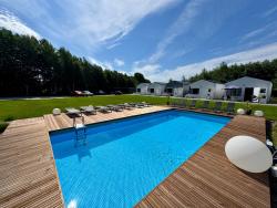noclegi Rewal Lumi Resort - domki nad morzem - w otoczeniu natury - z podgrzewanym basenem i siłownią