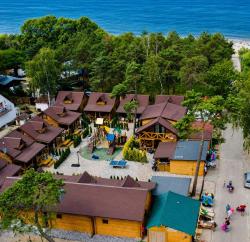 noclegi Dziwnówek Domy z Bala przy plaży- Domki klimatyzowane - JACUZZI, SAUNA, lody, popcorn, ryba wedzona i ognisko gratis-od maja!