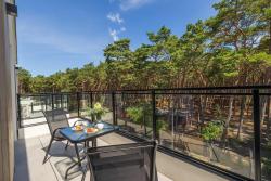 noclegi Międzywodzie Sunny Apartment with a Balcony & Parking Near the Beach in Międzywodzie by Noclegi Renters