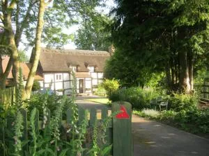 THE MOATS - CODDINGTON A small private thatched cottage B&B located in quiet countryside between Ledbury and Malvern - convenient for the Malvern Three Counties Showground and 5 miles from excellent shops restaurants and the annual Poetry Festival which - Colwall