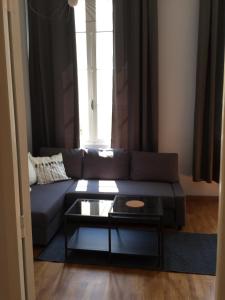 Appartements Coeur de ville grand-rue Jean Moulin : photos des chambres