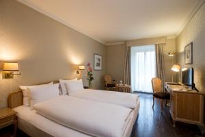 King Room with Balcony and River View room in Lindner Grand Hotel Beau Rivage