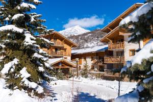 Appartements travelski home premium - Residence Le Hameau du Rocher Blanc 4 stars : photos des chambres