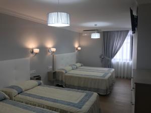 Comfort Quadruple Room room in Hostal Plaza Damasco