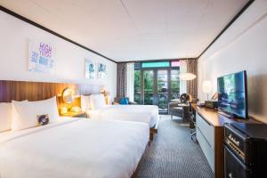 Queen Room with Two Queen Beds and Pool View room in The Verb Hotel