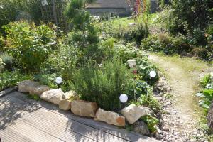 Maisons de vacances Dans un jardin : photos des chambres