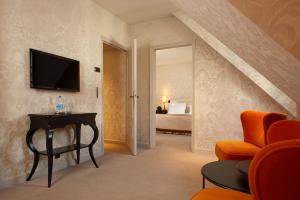 Hotels Le Pavillon de la Reine & Spa : photos des chambres