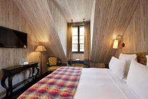 Hotels Le Pavillon de la Reine & Spa : photos des chambres