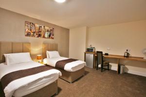 New County Hotel & Serviced Apartments by RoomsBooked