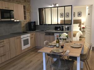 Appartements Le Petit Faubourg : photos des chambres