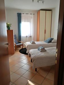 Camera Doppia con Letti Singoli e Bagno in Comune
