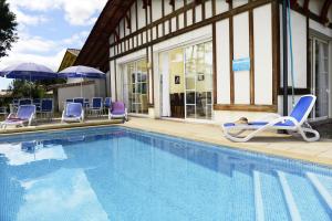Villages vacances Residence Odalys Les Greens du Bassin : photos des chambres
