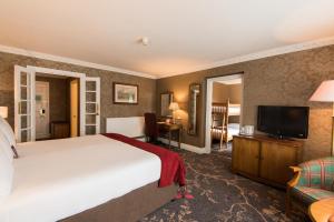 Classic Family Room with One King Bed and Bunk Bed room in Kingsmills Hotel Inverness