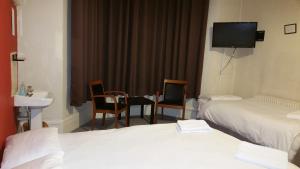 Triple Room with Shared Bathroom room in Best Inn Hotel
