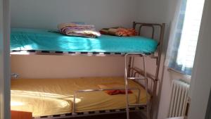 Three-Bedroom Apartment room in Residence Onda Blu