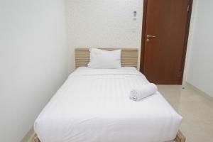 Affordable 2BR At LAvenue Apartment By Travelio