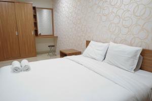 Affordable 2BR At LAvenue Apartment By Travelio