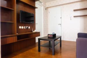 2BR Modern Room Bassura City Apartment with Direct Access To Shopping Center By Travelio