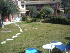 Menigos 57 seafront with garden Corfu Greece