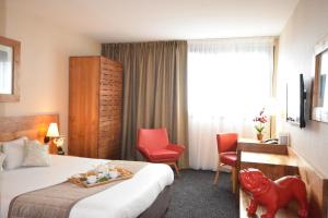 Hotels Kyriad Prestige Bordeaux Aeroport : photos des chambres