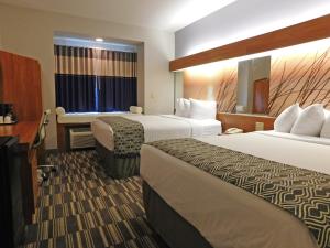 Queen Room with Two Queen Beds - Non-Smoking room in Microtel Inn and Suites by Wyndham Port Charlotte
