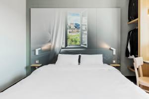 Hotels B&B HOTEL Lyon Grand Stade Meyzieu : photos des chambres