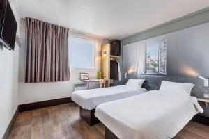 Hotels B&B HOTEL Lyon Grand Stade Meyzieu : photos des chambres