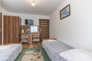 Pokoje i Apartamenty Poducha