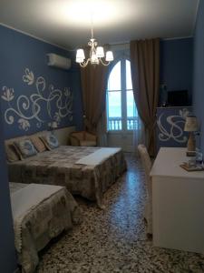 Triple Room with Sea View room in B&B Villa Raineri