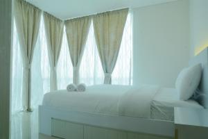 Scandinavian Style 2BR Apartment Woodland Park Residence By Travelio